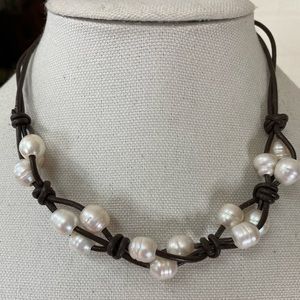 Freshwater pearls braided on a leather necklace